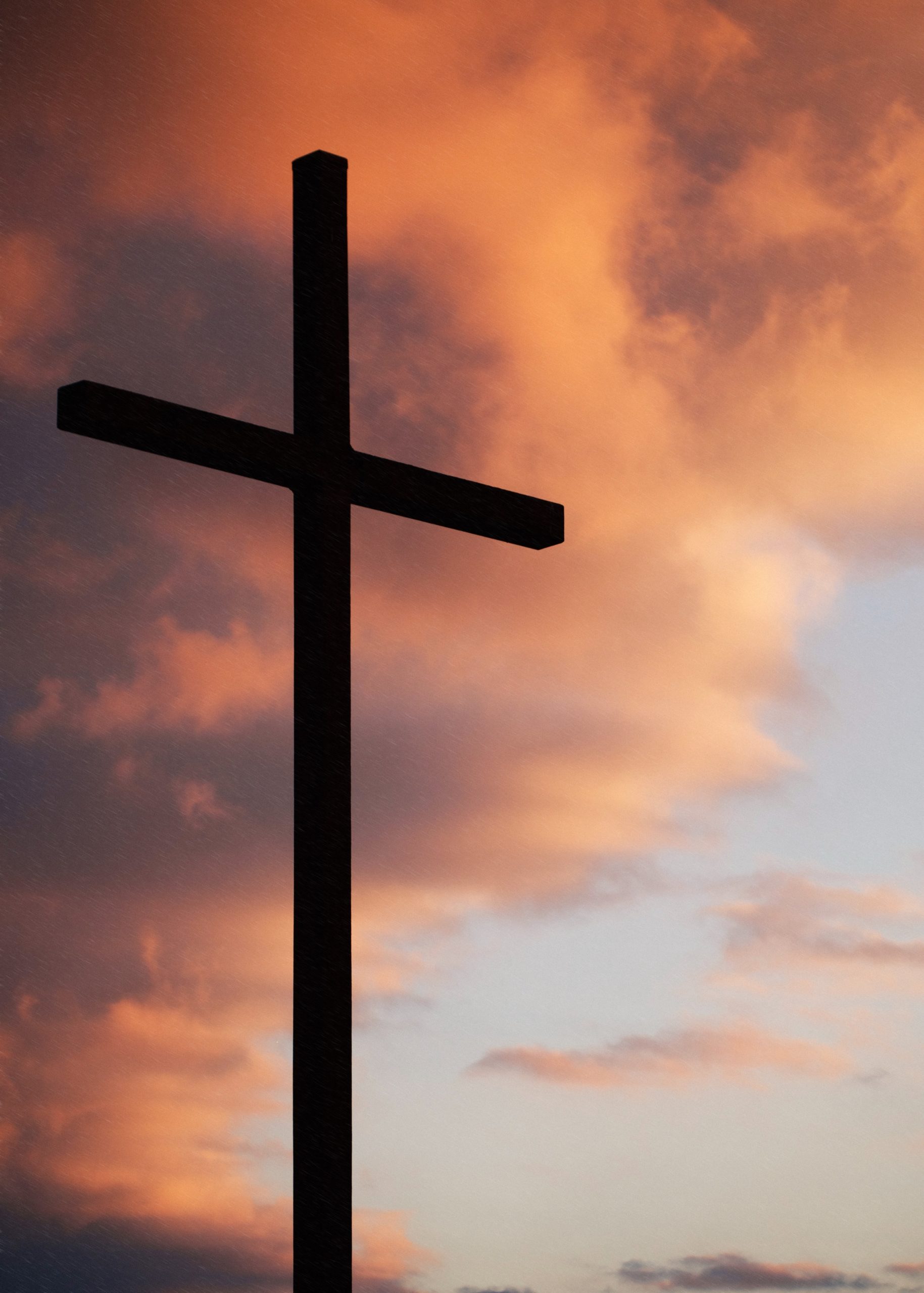 Cross against sunset