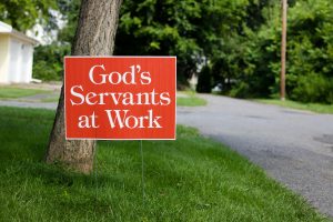 Sign board saying God's servants at work
